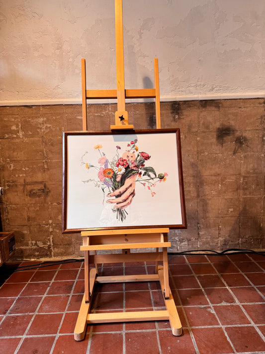 Floral painting on an easel against a textured wall. Artwork by Joëlle Diane of Monochrome Canvas.