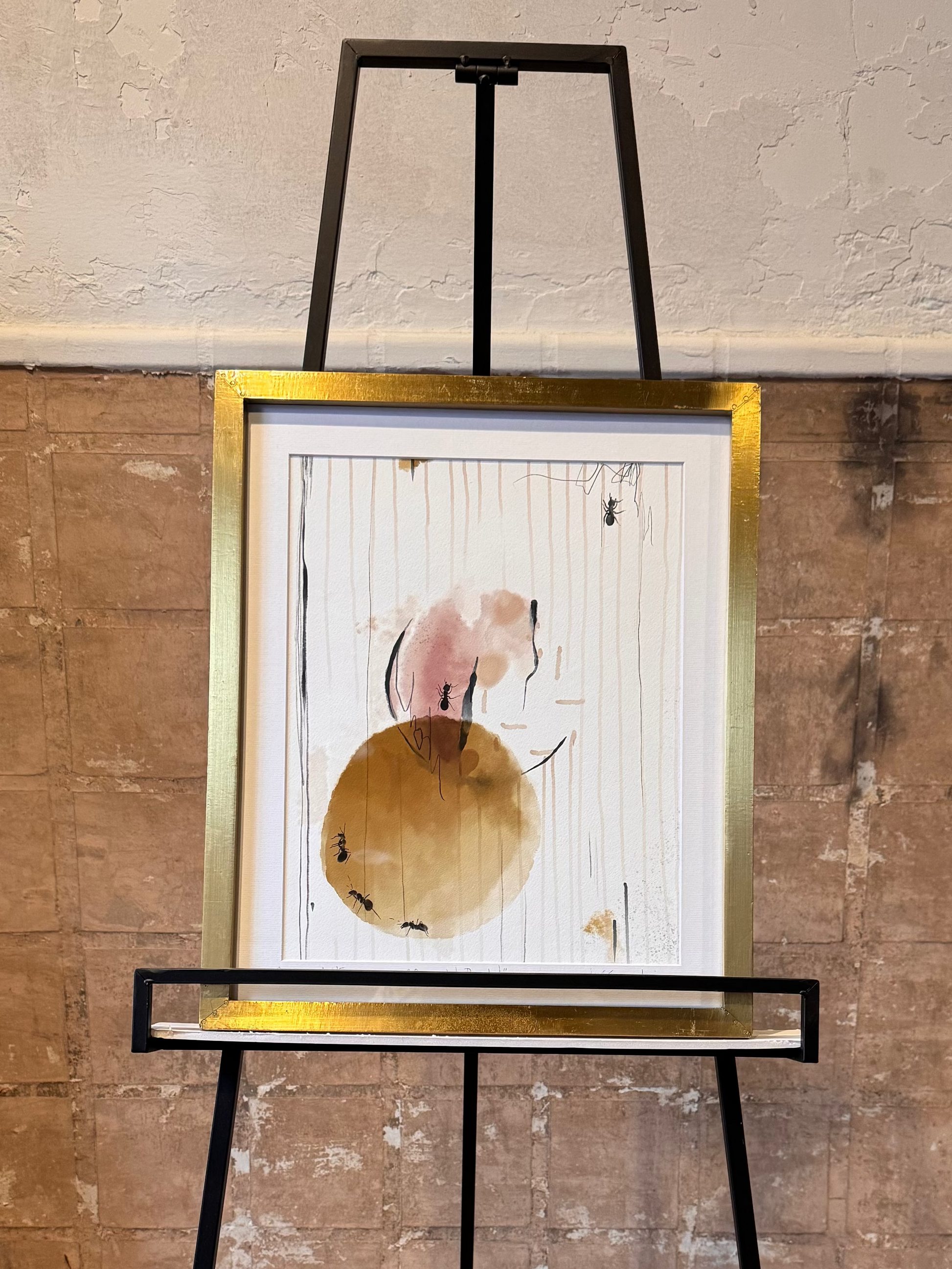 Artistic abstract painting with ants on a stand against a textured wall. Artist: Joëlle Diane