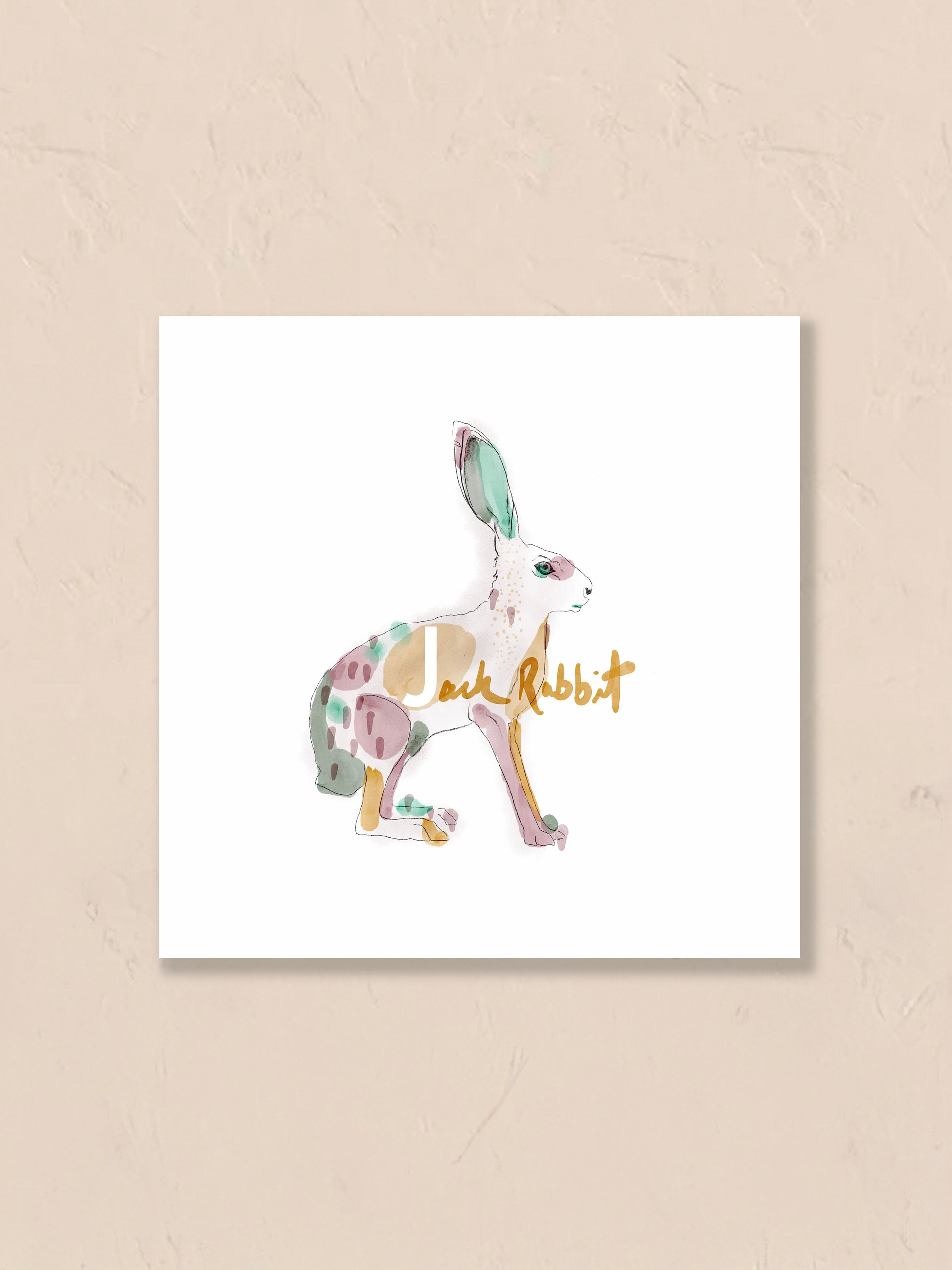 Watercolor painting of a jack rabbit with the letter 'J' floating on a beige background. Artist: Joëlle Diane